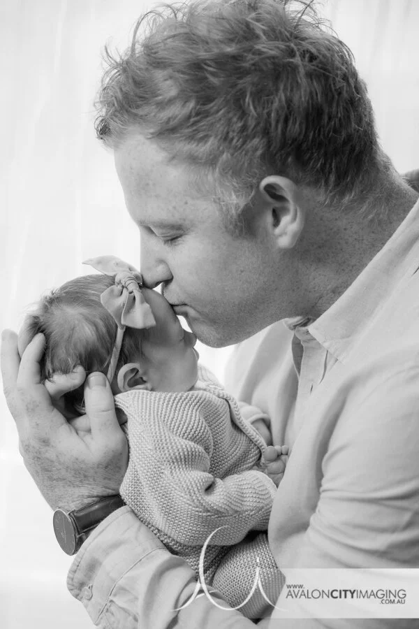 Adelaide Newborn Photography - Dad kissing newborn baby girls forehead