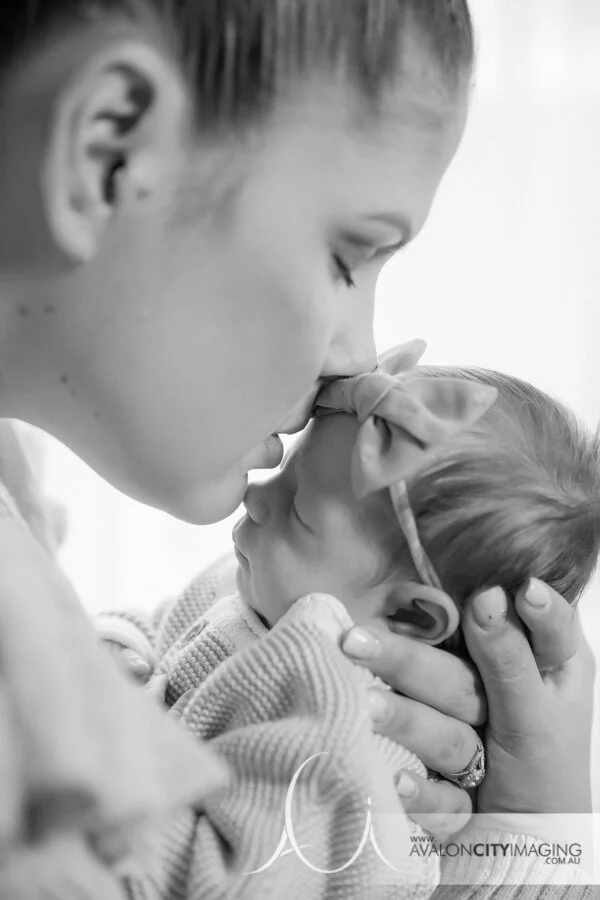 newborn photography - newborn sleeping in mum’s hands with tender connection bw.jpg