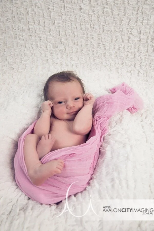 Adelaide Newborn Photography - Cute newborn baby girl in pink wrap