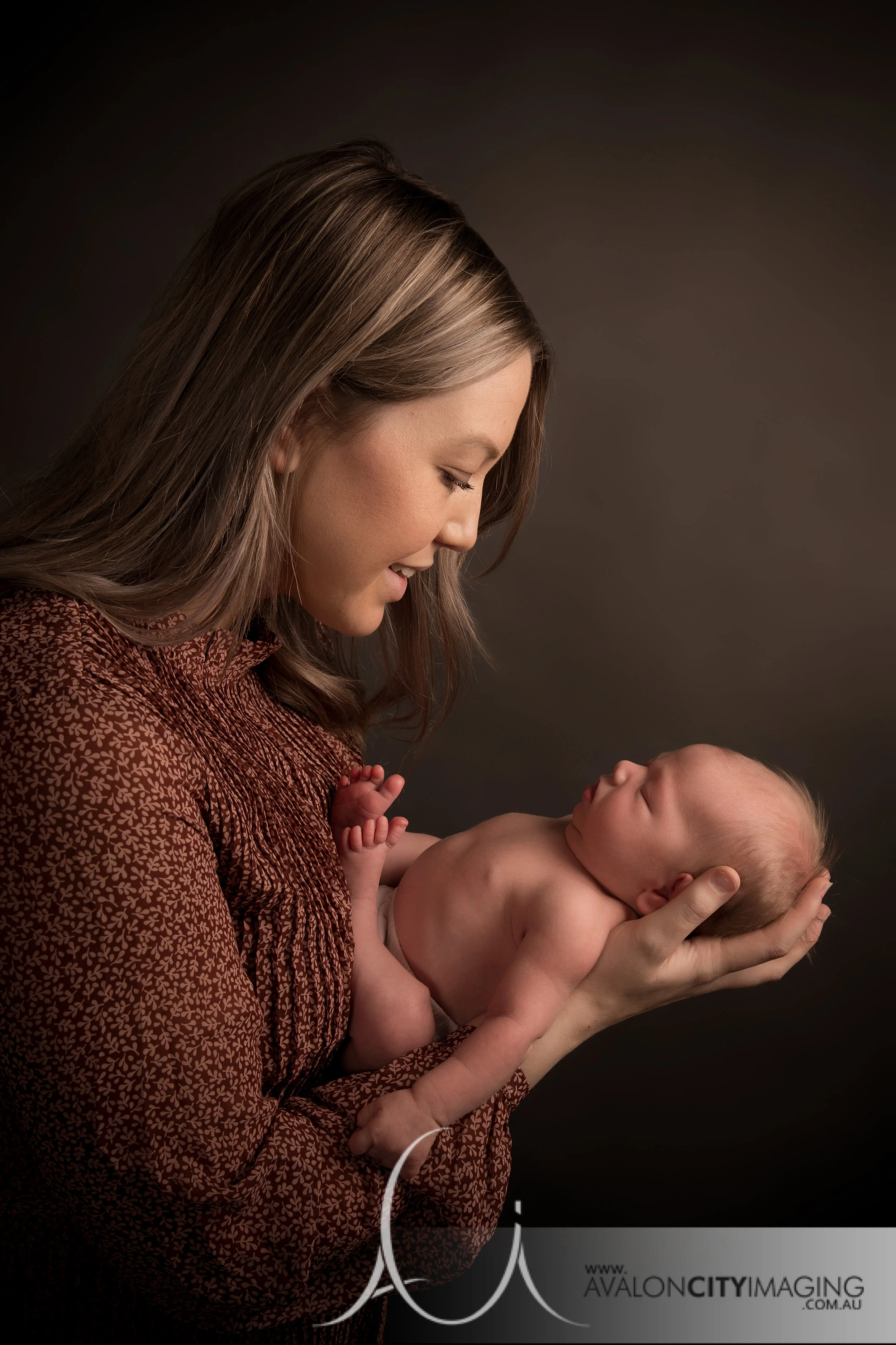 Adelaide Newborn Photography - Mum holding newborn baby in studio