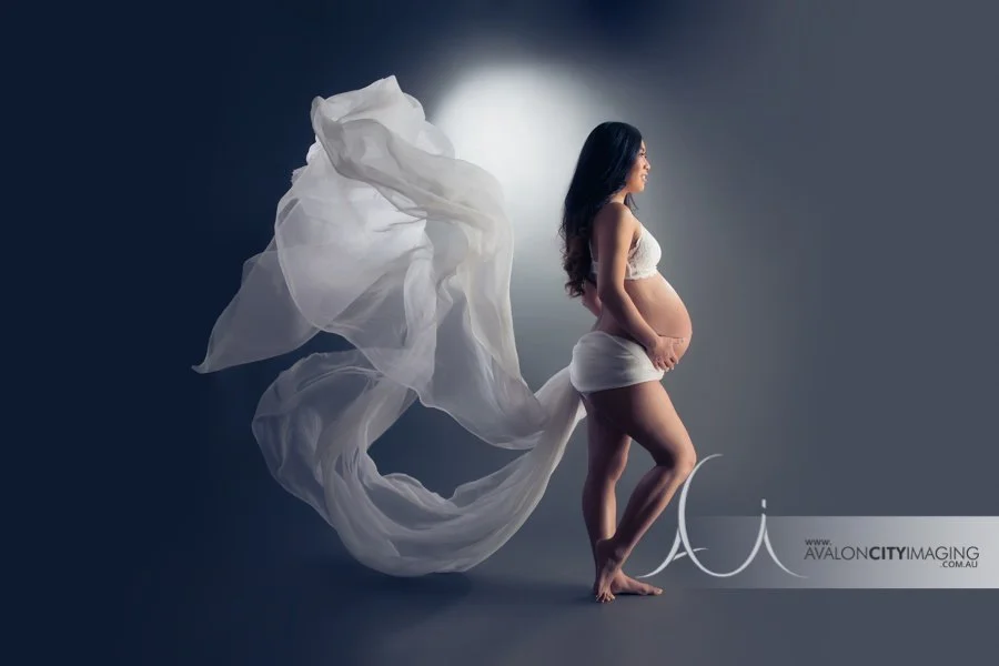 maternity photography - artistic elegant maternity silhouette with soft backlighting.jpg