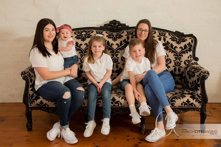 Family photography- extened family posed together in a studio setting.jpg
