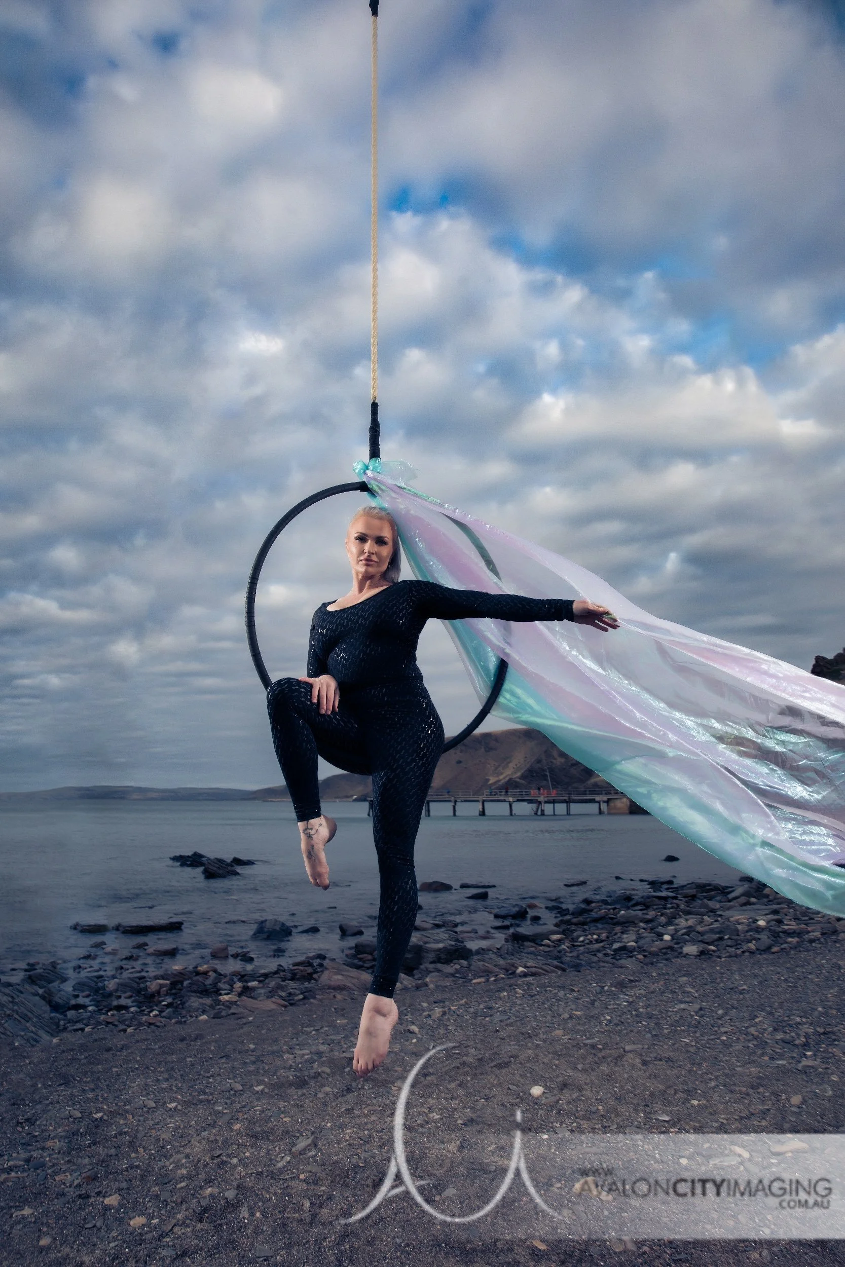 Pole photography-  Aerial hoop still shot with strong expresion in beach location.jpg