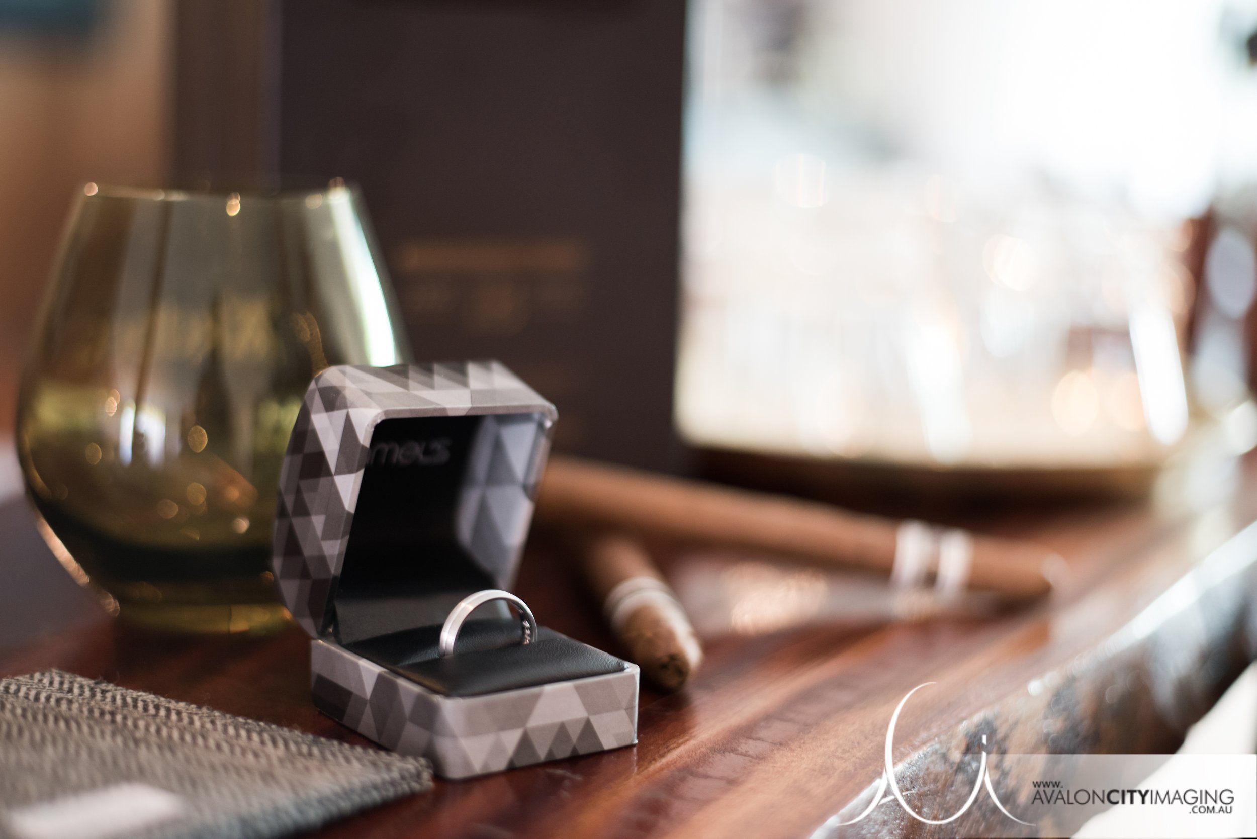 Grooms wedding ring and cigars 