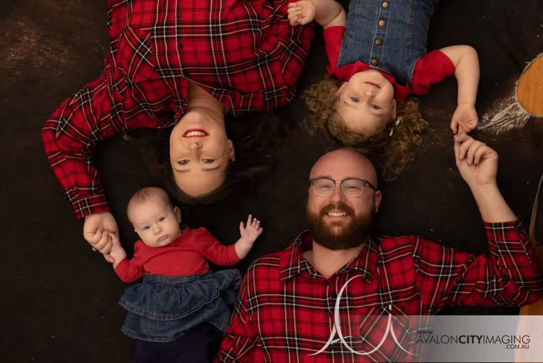 Family photography- awkward style family photography family in matching red plaid and jeans.jpg