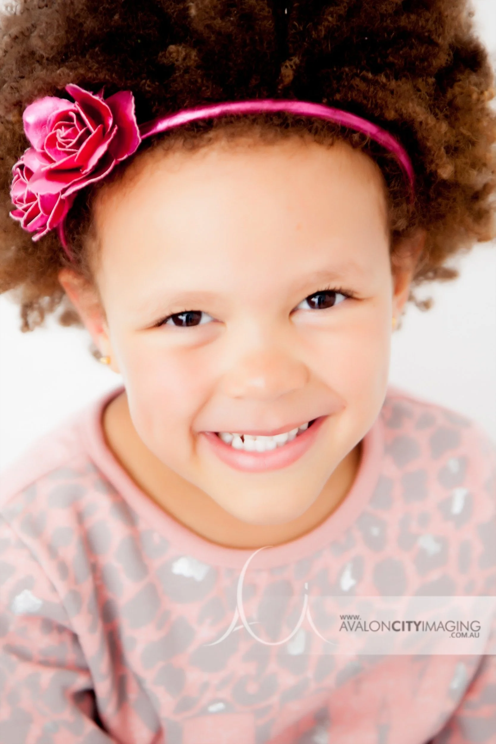 Family photography- bright child portrait with clean studio lighting.jpg