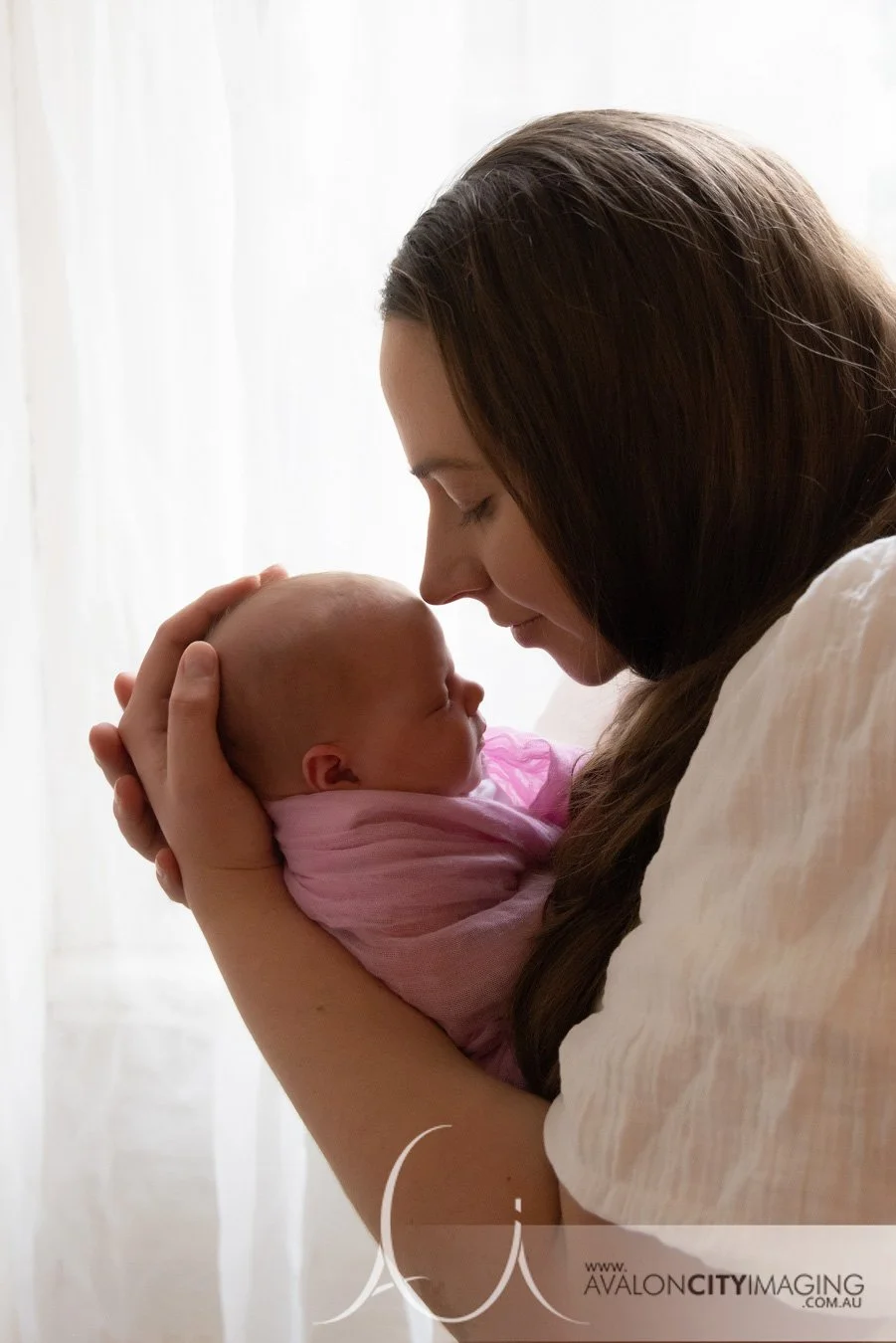 Adelaide Newborn Photography - Mum and newborn baby in front of window 