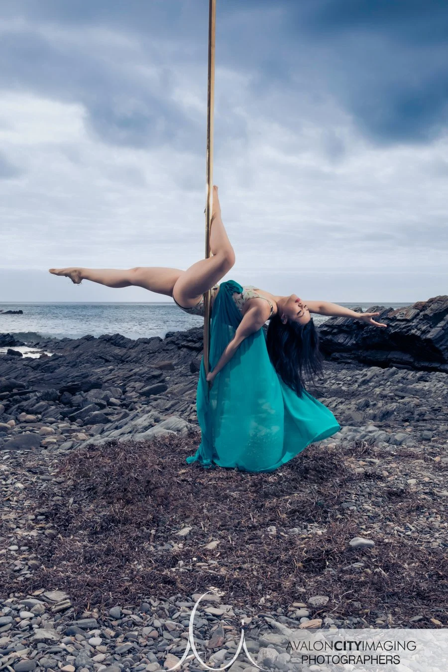 Pole photography- dancer performing an inverted pole hold.jpg