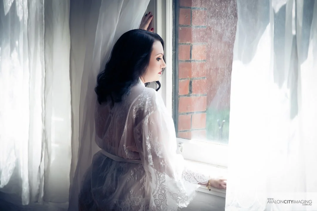 Natural‑light boudoir portrait near a window.jpg