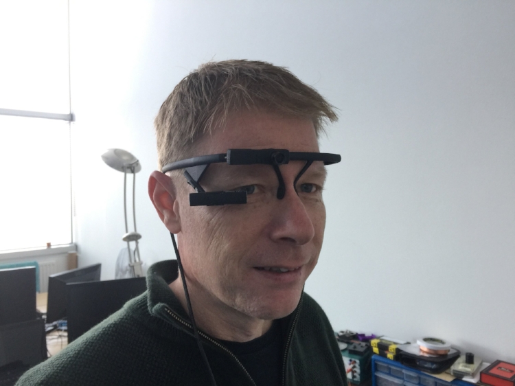 Project manager Simon modelling the Pupil Labs eye tracker