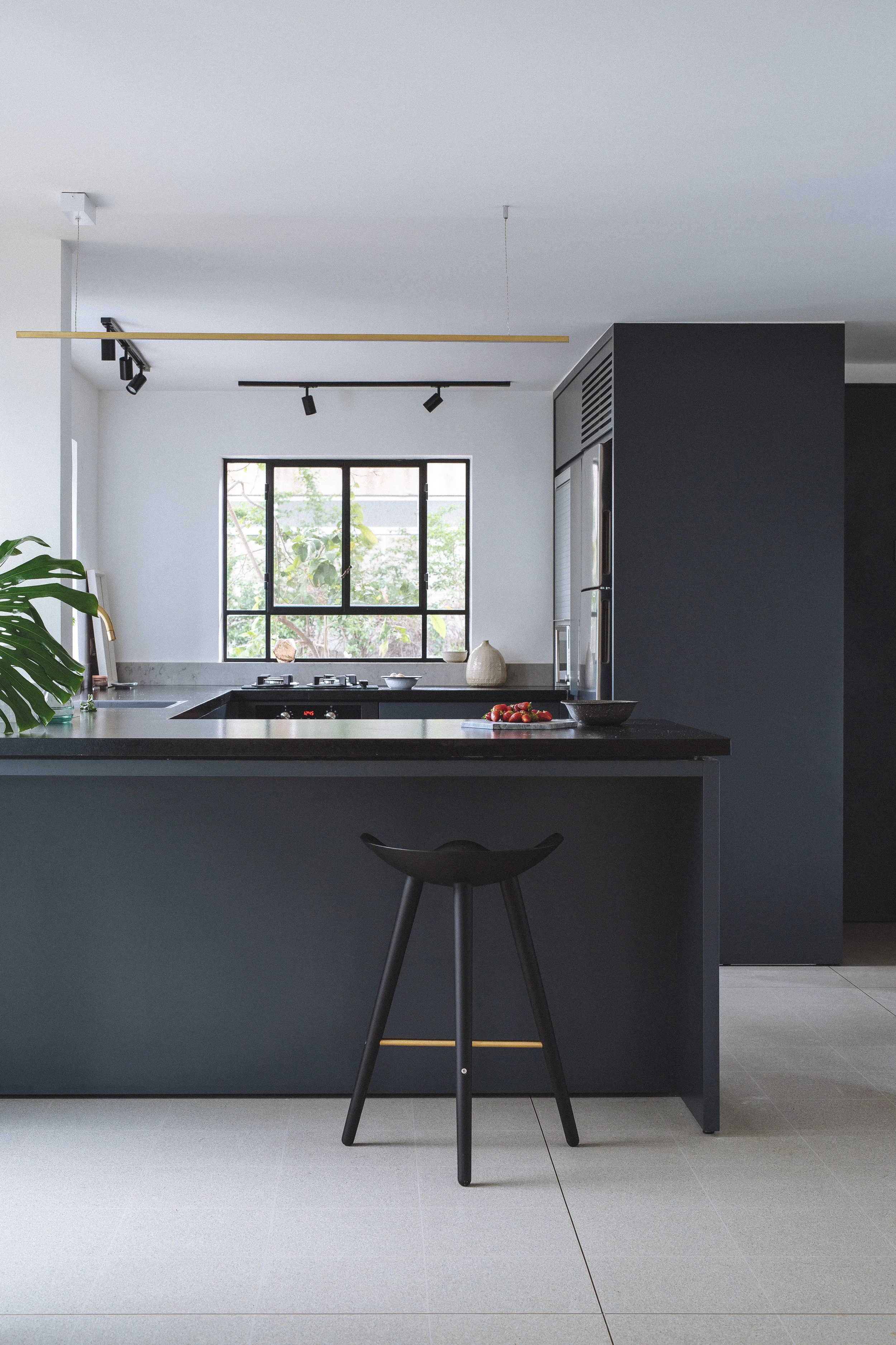Modern kitchen in blue and grey. Terrazzo flooring