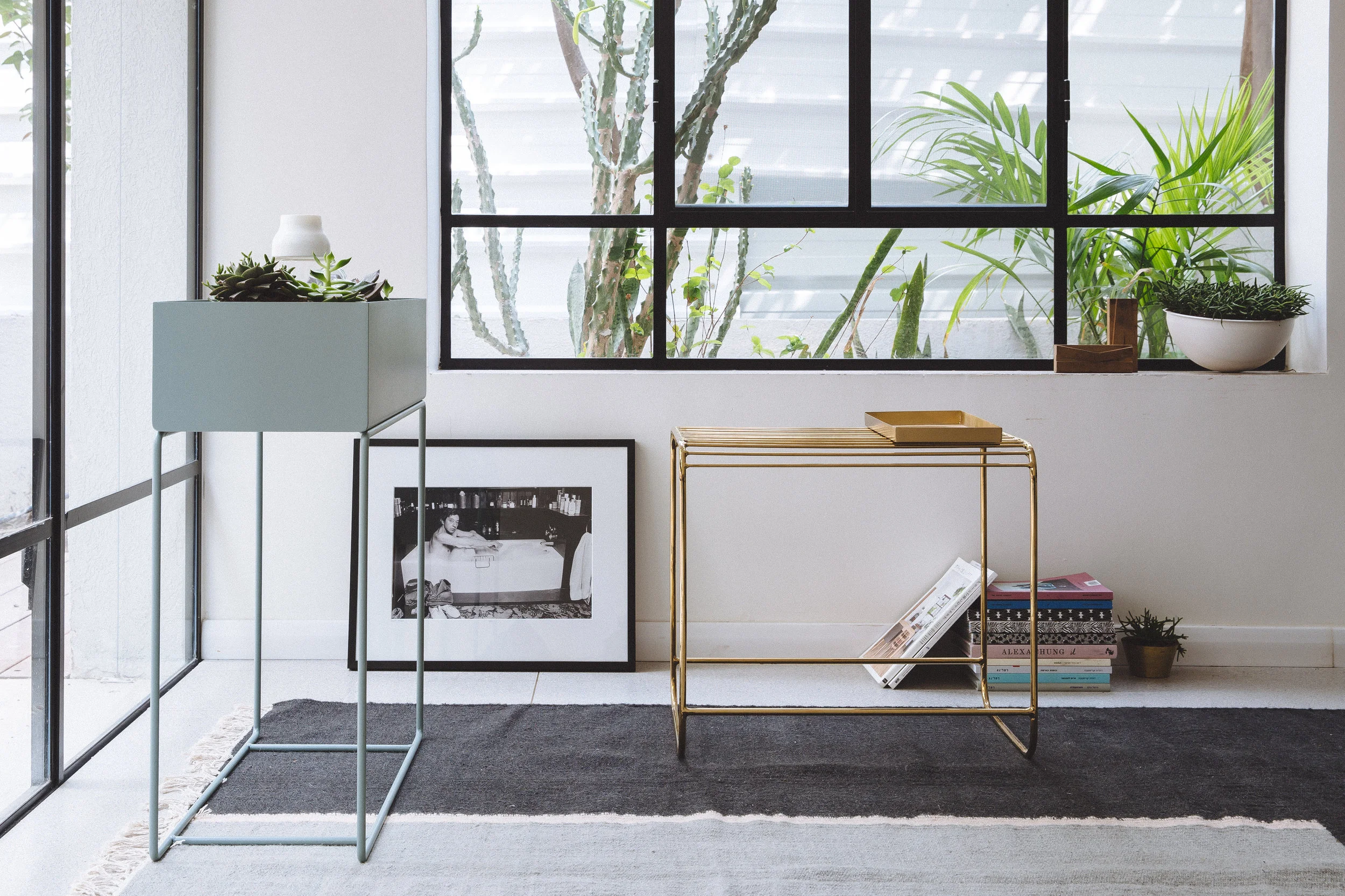 Ferm living plant box. Bloomingville brass table. Serge Gainsbourg photo. Living room design