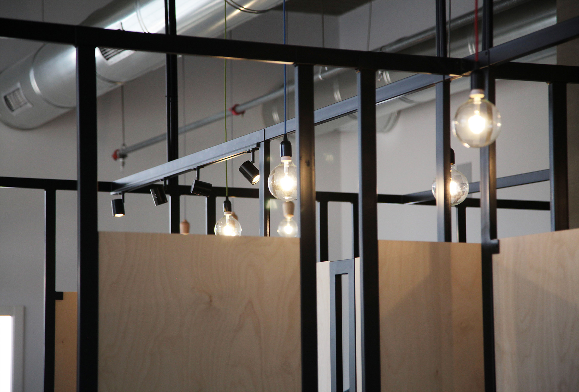 steel construction of wood dividers combined with lighting