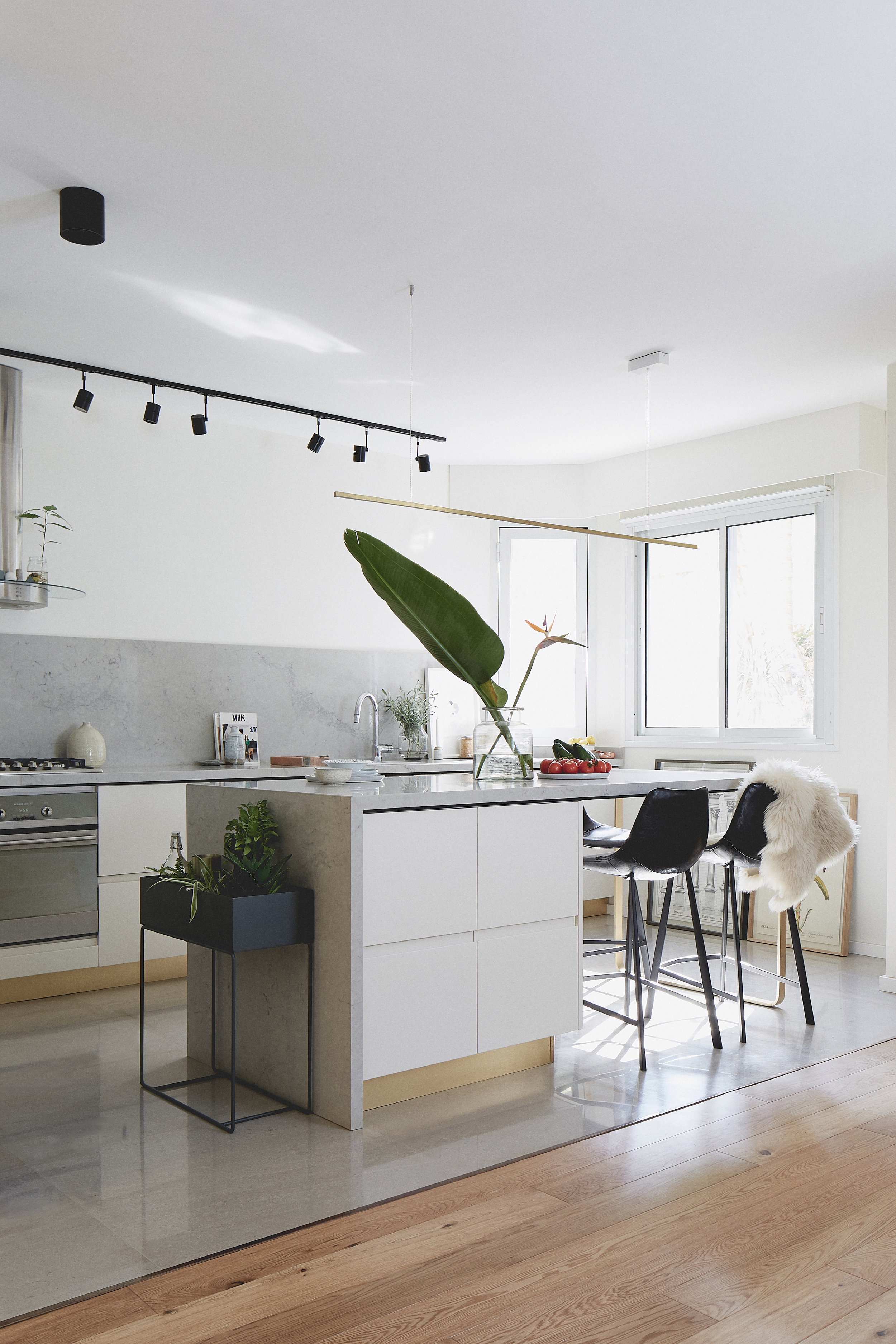 light grey kitchen with brass details 