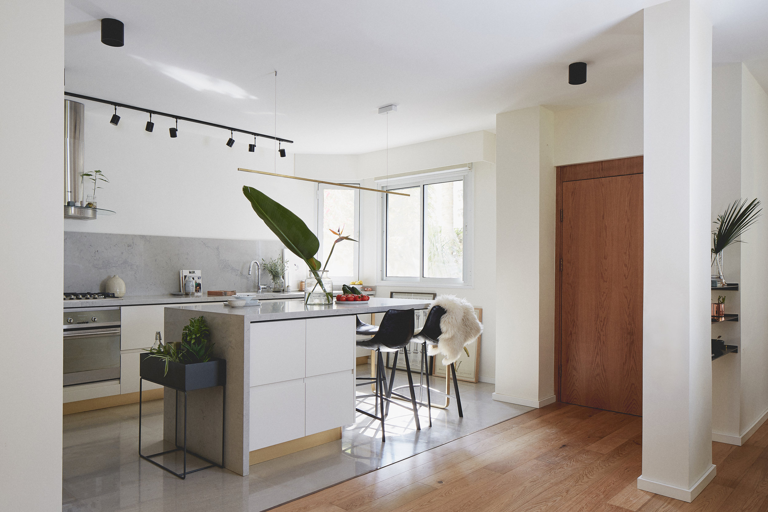 light grey kitchen with brass details