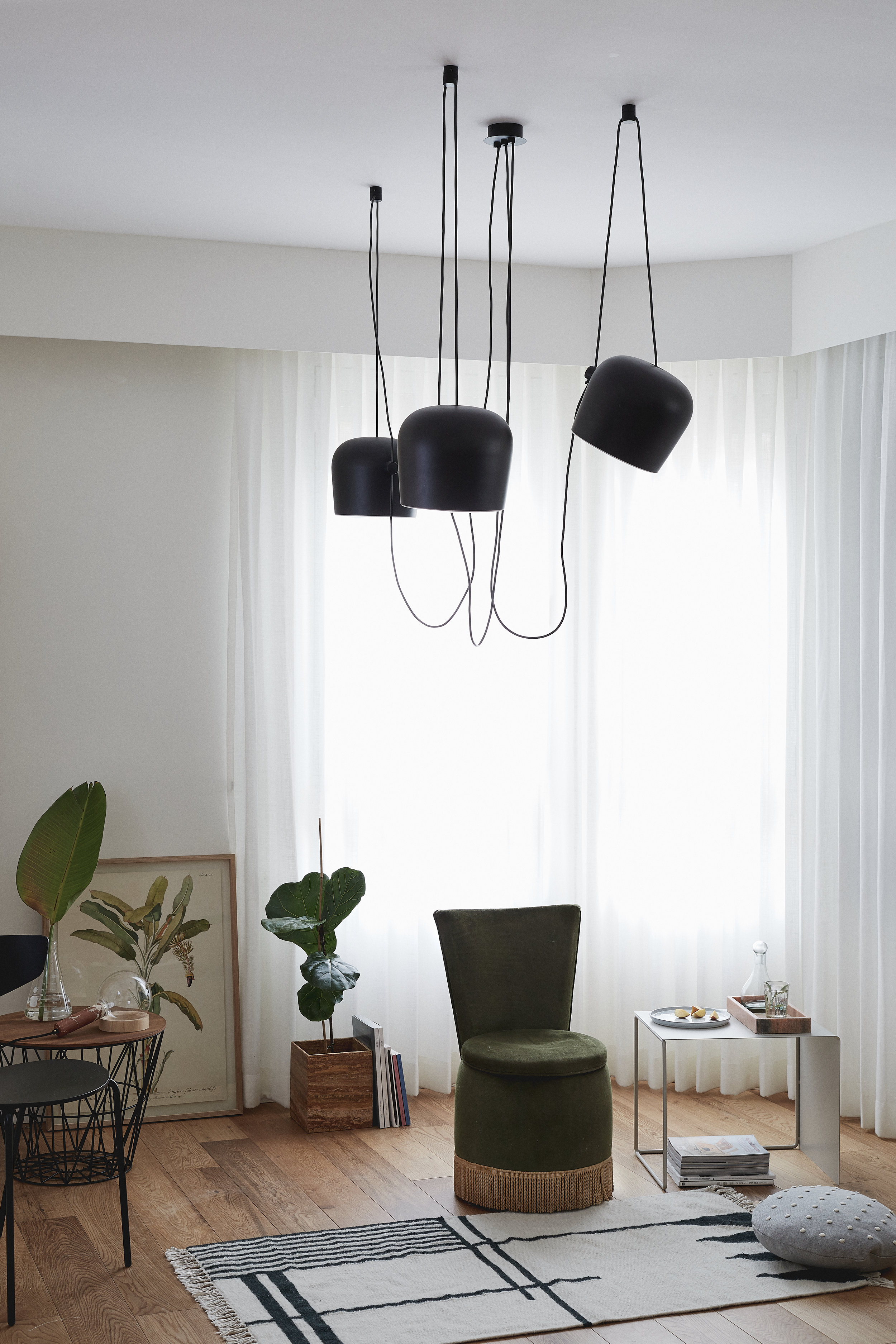 Flos lighting. green velvet chair. Ferm Living furniture