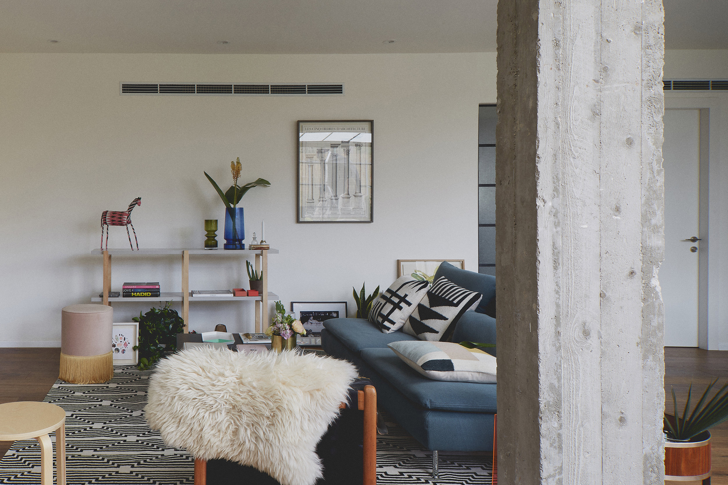 concrete column apartment decor fur ottoman living room