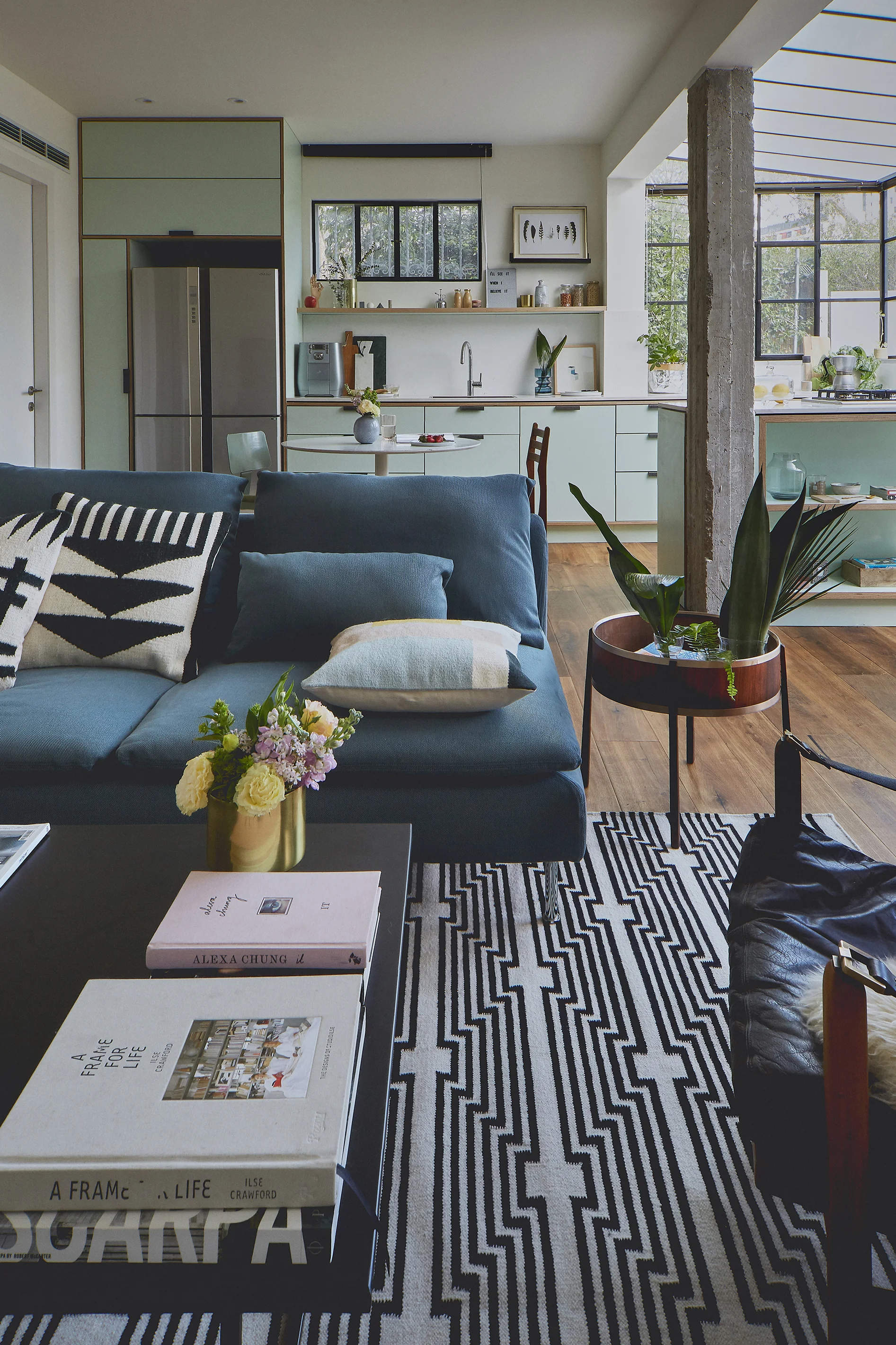 mint green kitchen eclectic living room ferm concrete columns