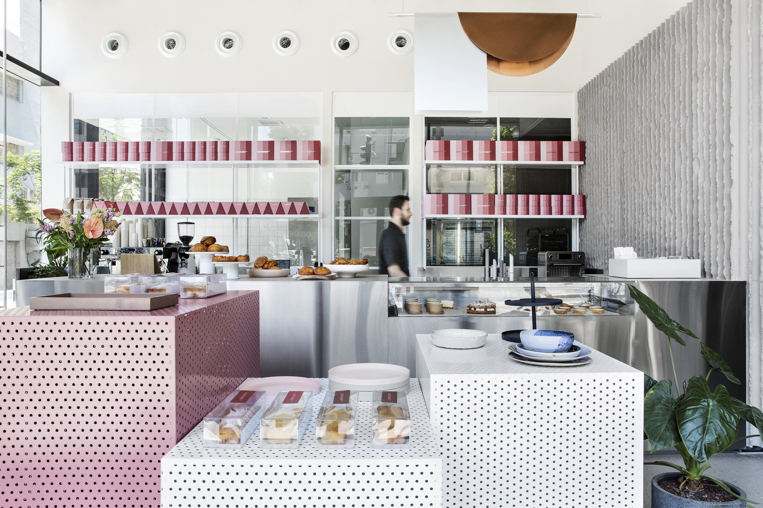 Alon Shabo store, perforated metal boxes in white and pink