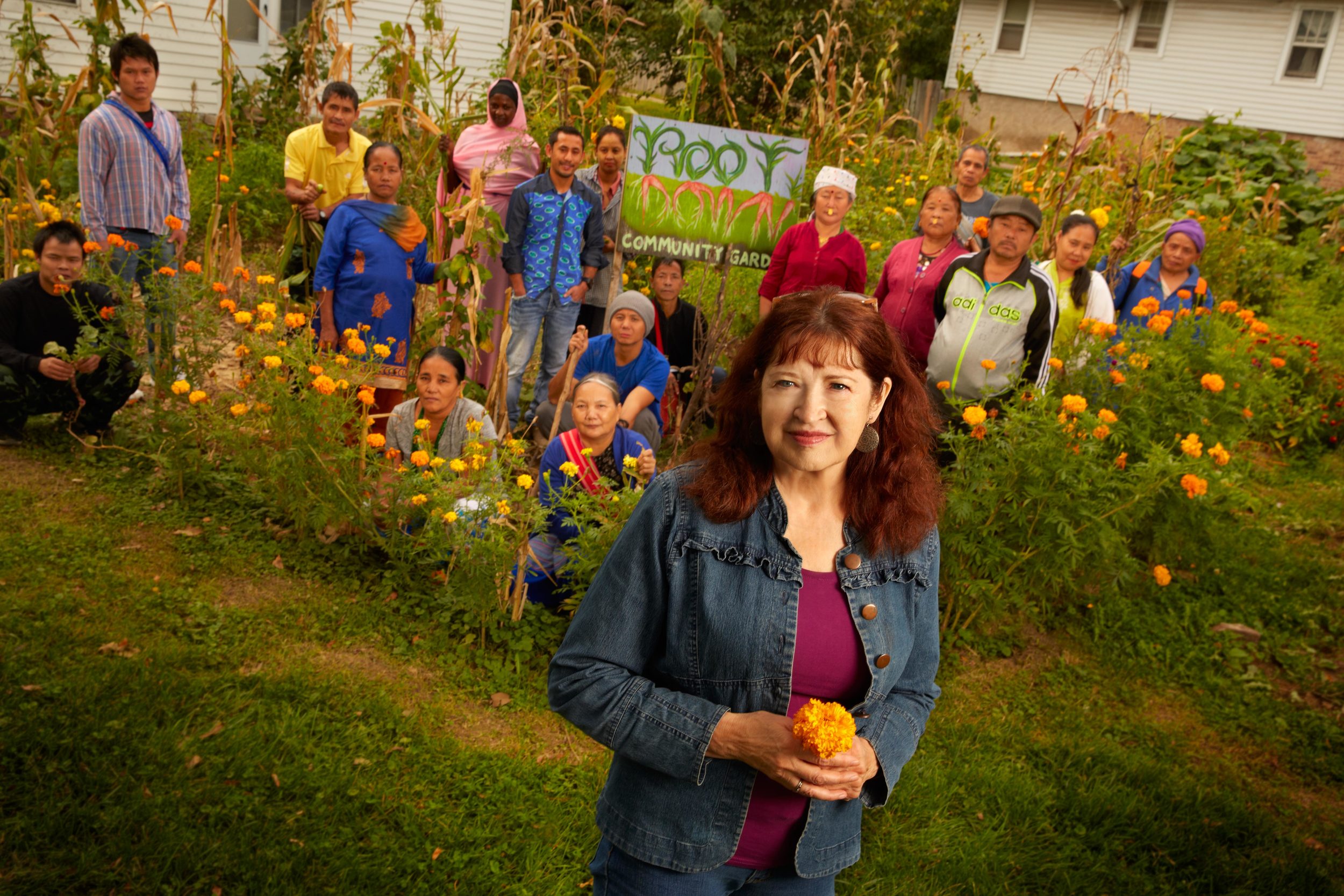 Barbara Dilly, Ph.D. (foreground), a professor in the Department of Cultural and Social Studies at Creighton University, is dedicated to community gardening. Root Down, one of two Bluejay Community Garden projects, is not only environmentally friendly, but connects Creighton to the community and refugees to each other and to their new home (Photo by Creighton University)