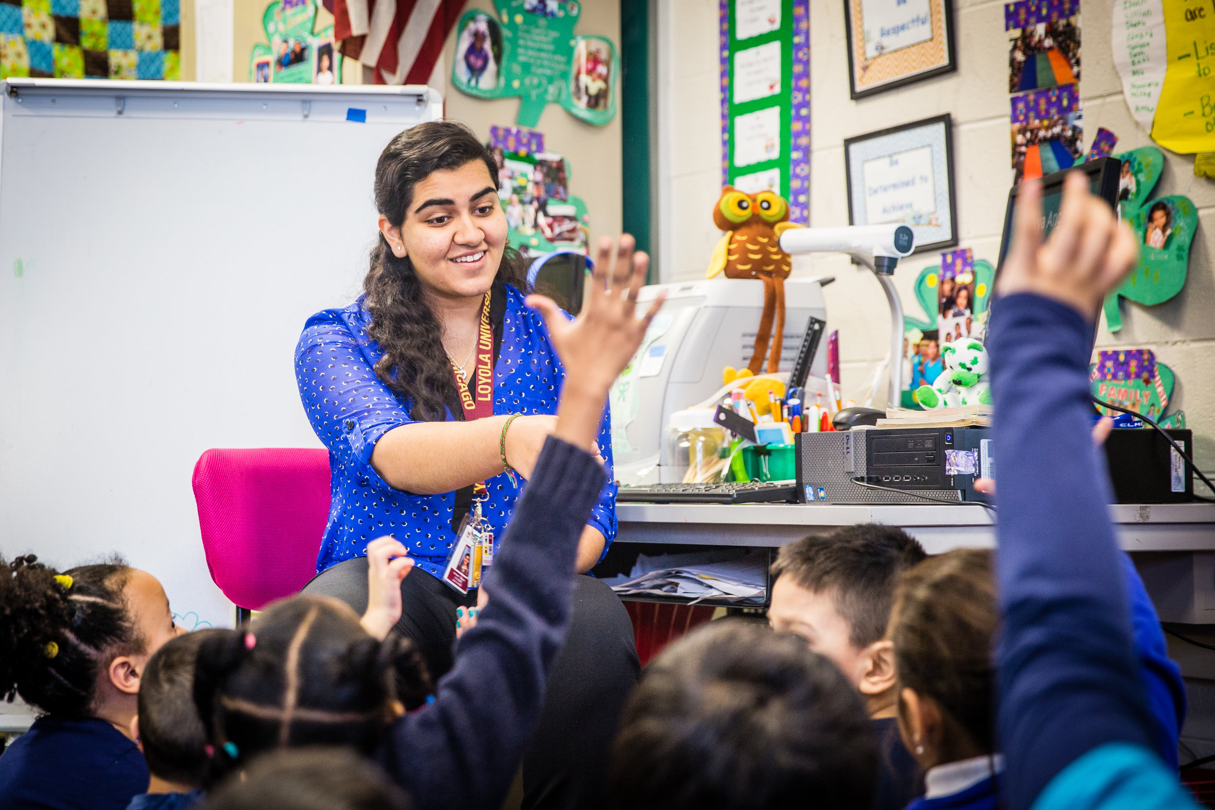 Armeen Sayani, a Loyola School of Education major, teaches a lesson on Maya Angelou to first graders in a Chicago Public School (Photo by Loyola University Chicago)