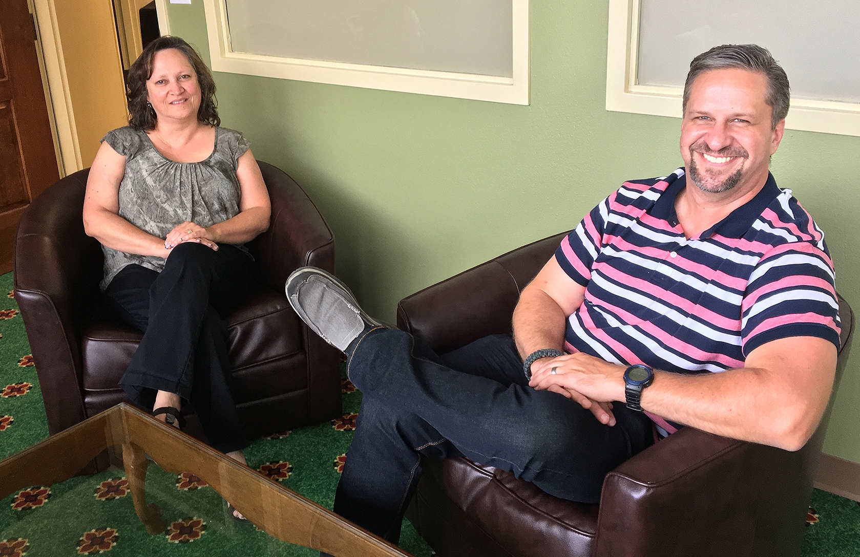 Regis University’s Andi Houdek, left, and Josh Kreimeyer sit in a counseling room at the Mt. Carmel Center for Excellence; Regis and Mt. Carmel have partnered together to provide counseling to veterans. (Photo by Regis University)