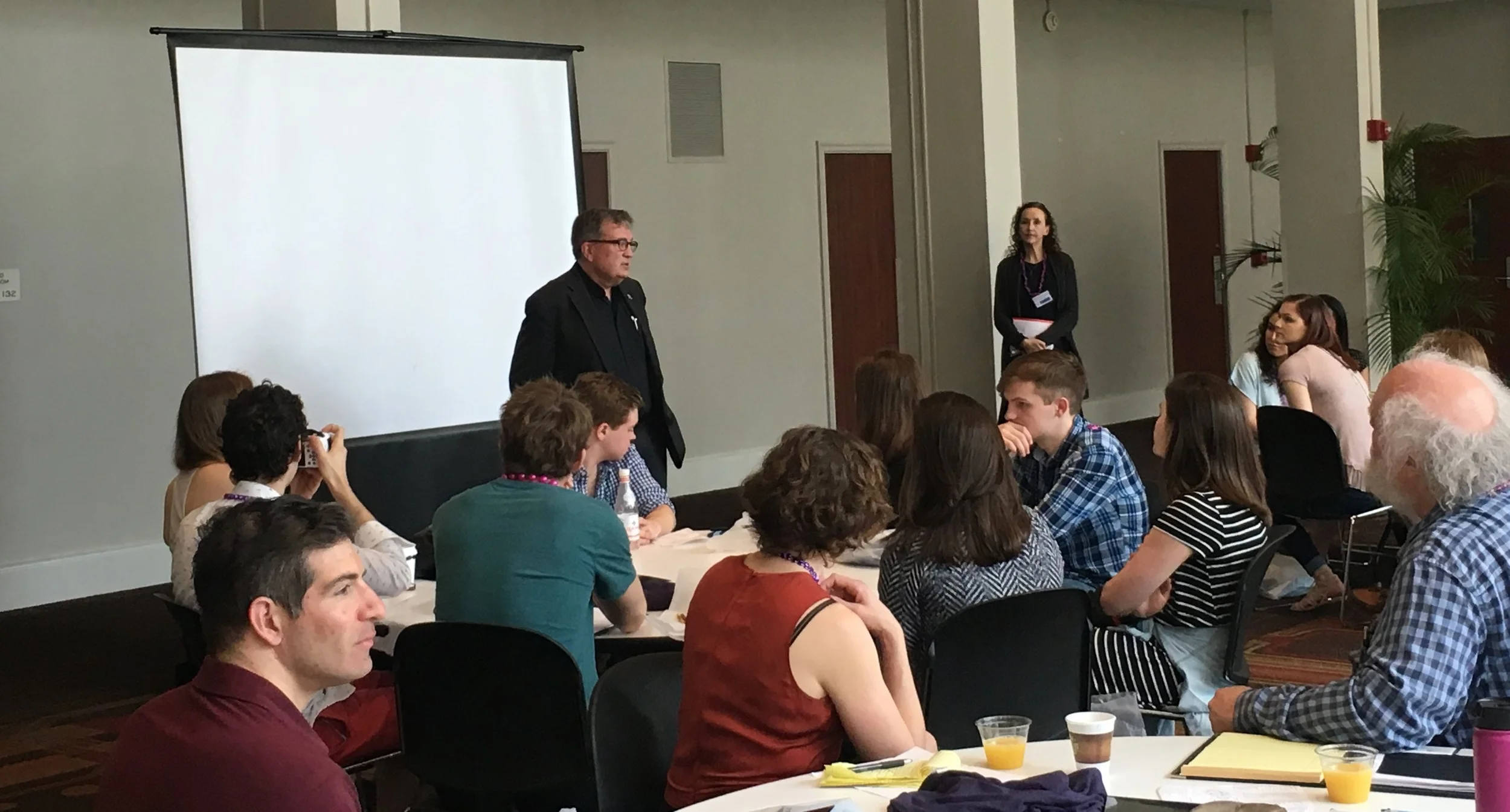 Loyola University New Orleans President Rev. Kevin Wm. Wildes, S.J. greets conference participants.