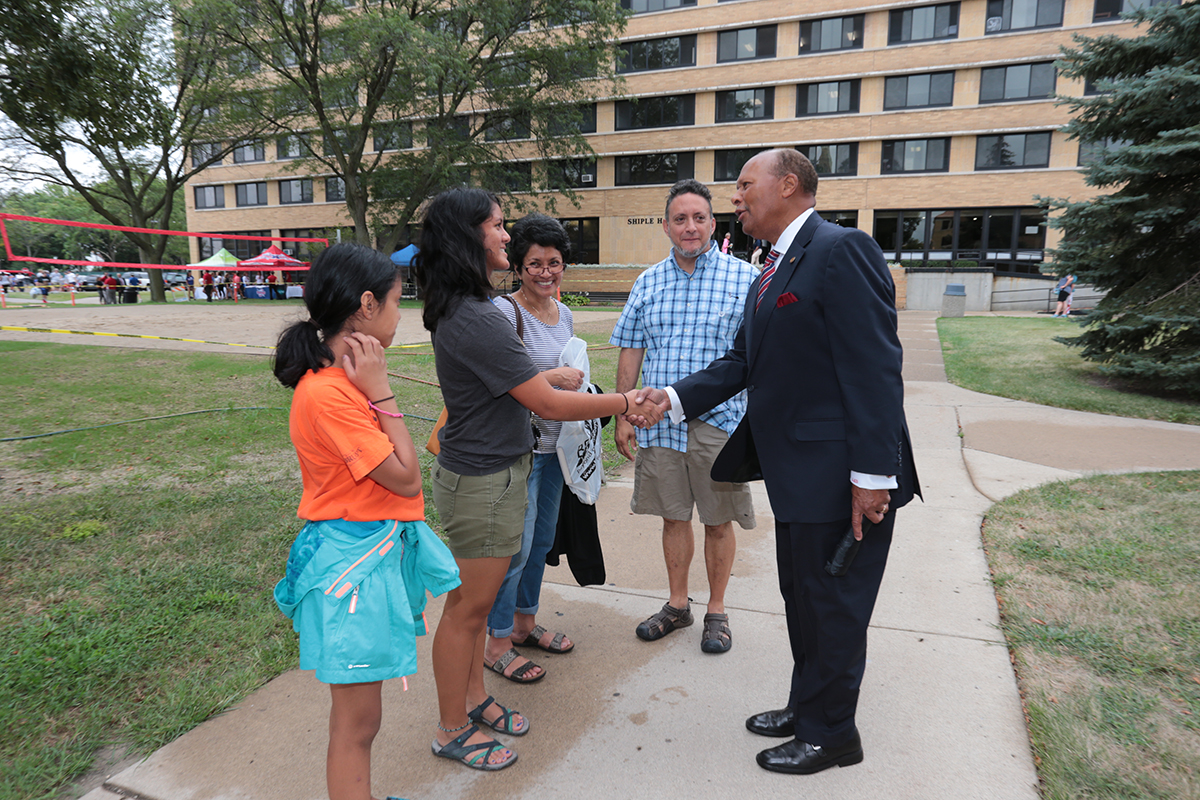University of Detroit Mercy president Dr. Antoine M. Garibaldi greets a new student and her family on move-in day, Aug. 22 (Detroit, MI)