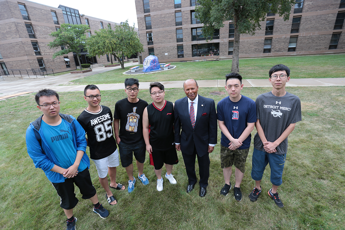 University of Detroit Mercy president Dr. Antoine M. Garibaldi (third from right) stands with a group of students from China who will study at Detroit Mercy this fall (Detroit, MI)
