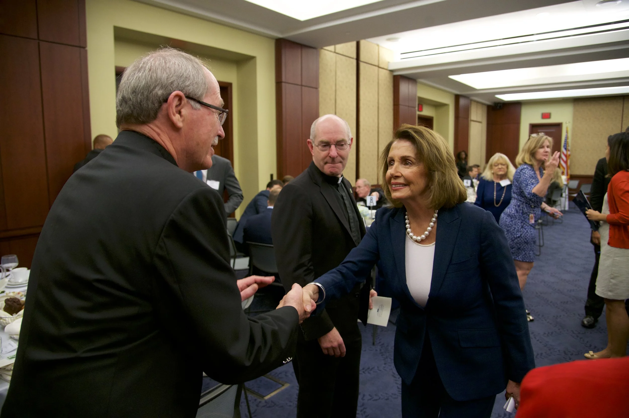 Rev. Michael Engh, S.J. (Santa Clara University), Rev. Paul Fitzgerald, S.J. (University of San Francisco), Representative Nancy Pelosi (D-CA)