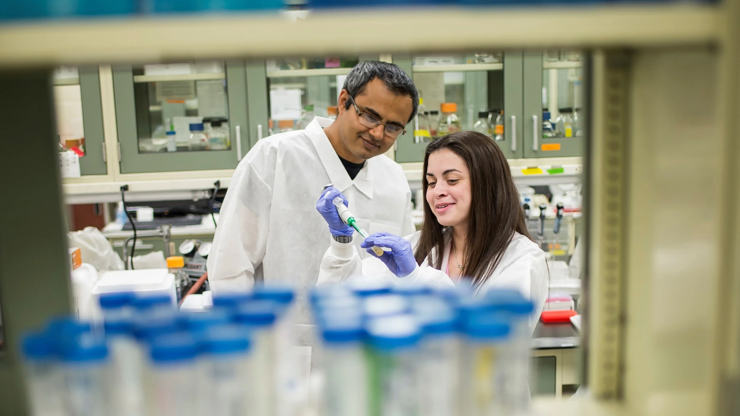 Dr. Shantanu Bhatt and Marisa Egan ’18, a student scholar who is researching E. albertii, a strain of bacteria in the same family as E. coli (photo by Saint Joseph's University)
