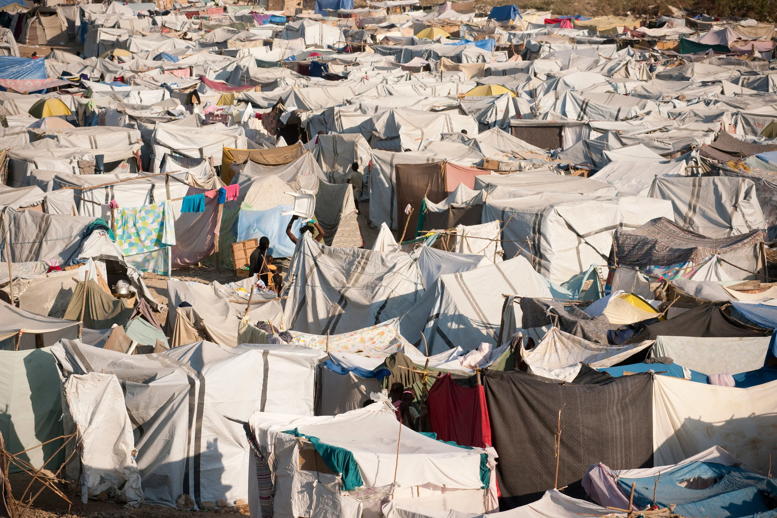 Tens of thousands of Haitians spent years living in tent cities following the 2010 earthquake (photo by Getty Images, courtesy of Loyola University Chicago)
