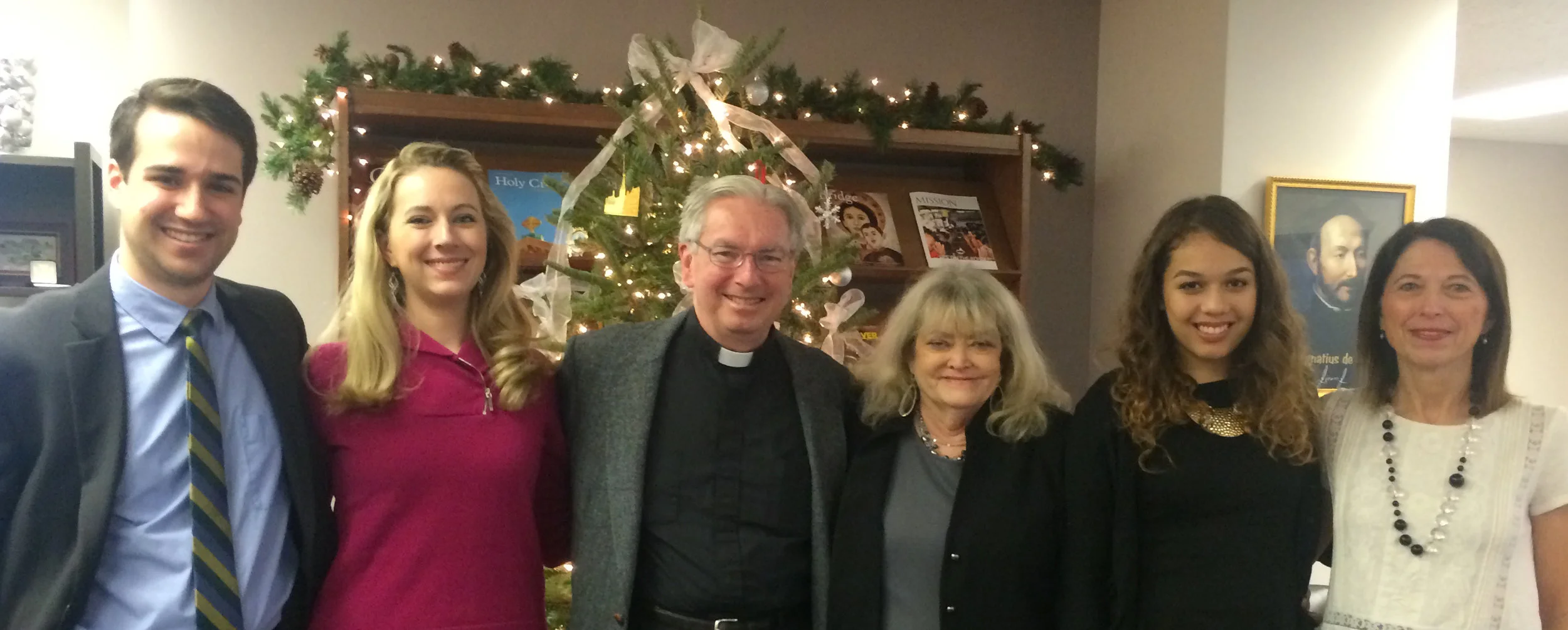 AJCU staff past and present (Christmas 2014): Patrick Nolan, Deanna Howes Spiro, Rev. Michael J. Sheeran, S.J., Cyndy Littlefield, Karen Larios and Brenda Hebert