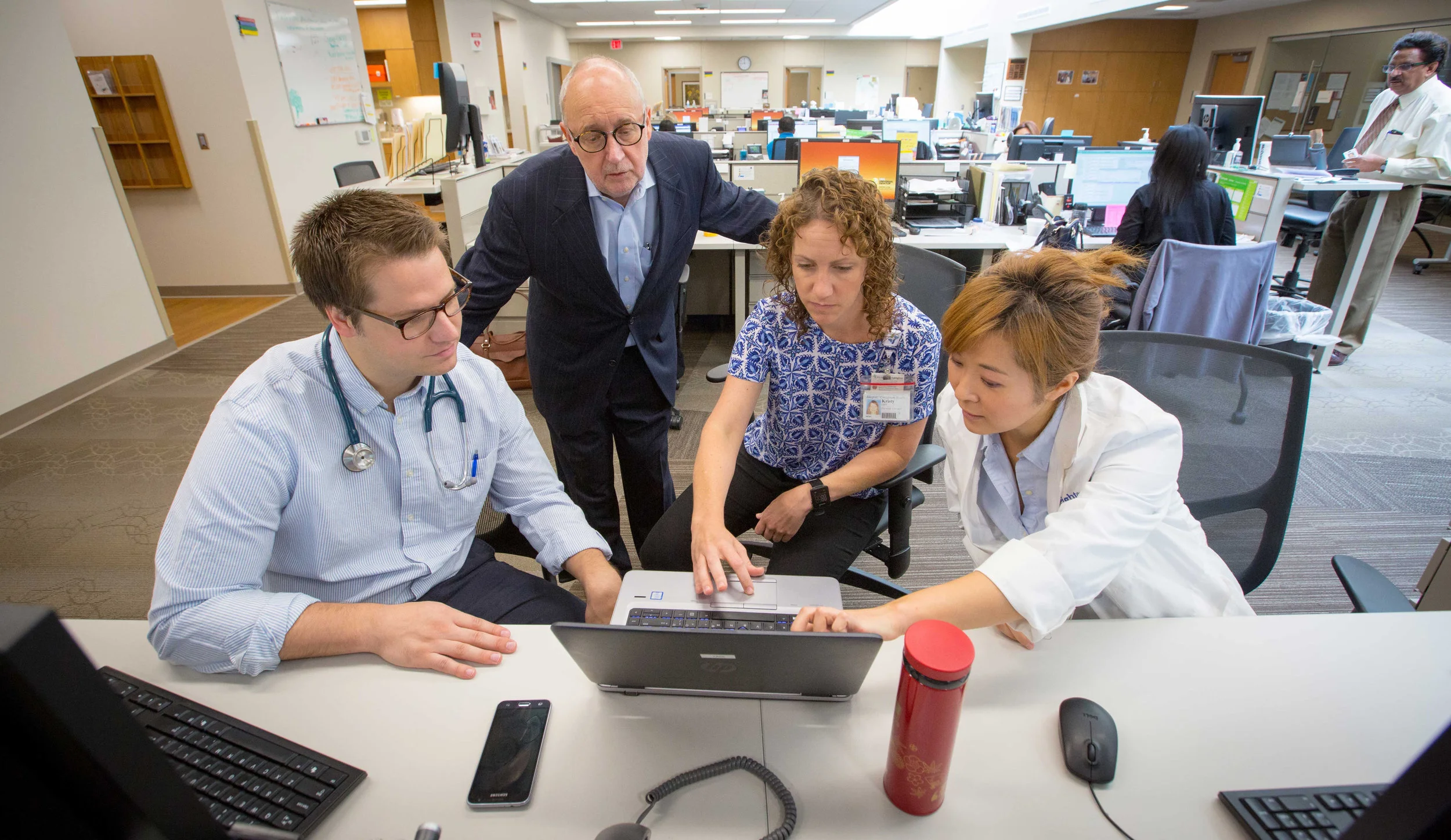 At CHI Health Creighton University Medical Center, clinicians, residents and students gather in the “huddle” as part of an innovative team-based approach. Team members from different health sciences backgrounds use their expertise for holistic health care (photo by Creighton University)