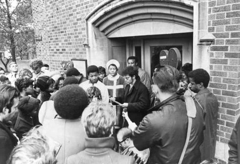 Students gather in protest outside O’Hara Hall in 1969 (photo by Marquette University)