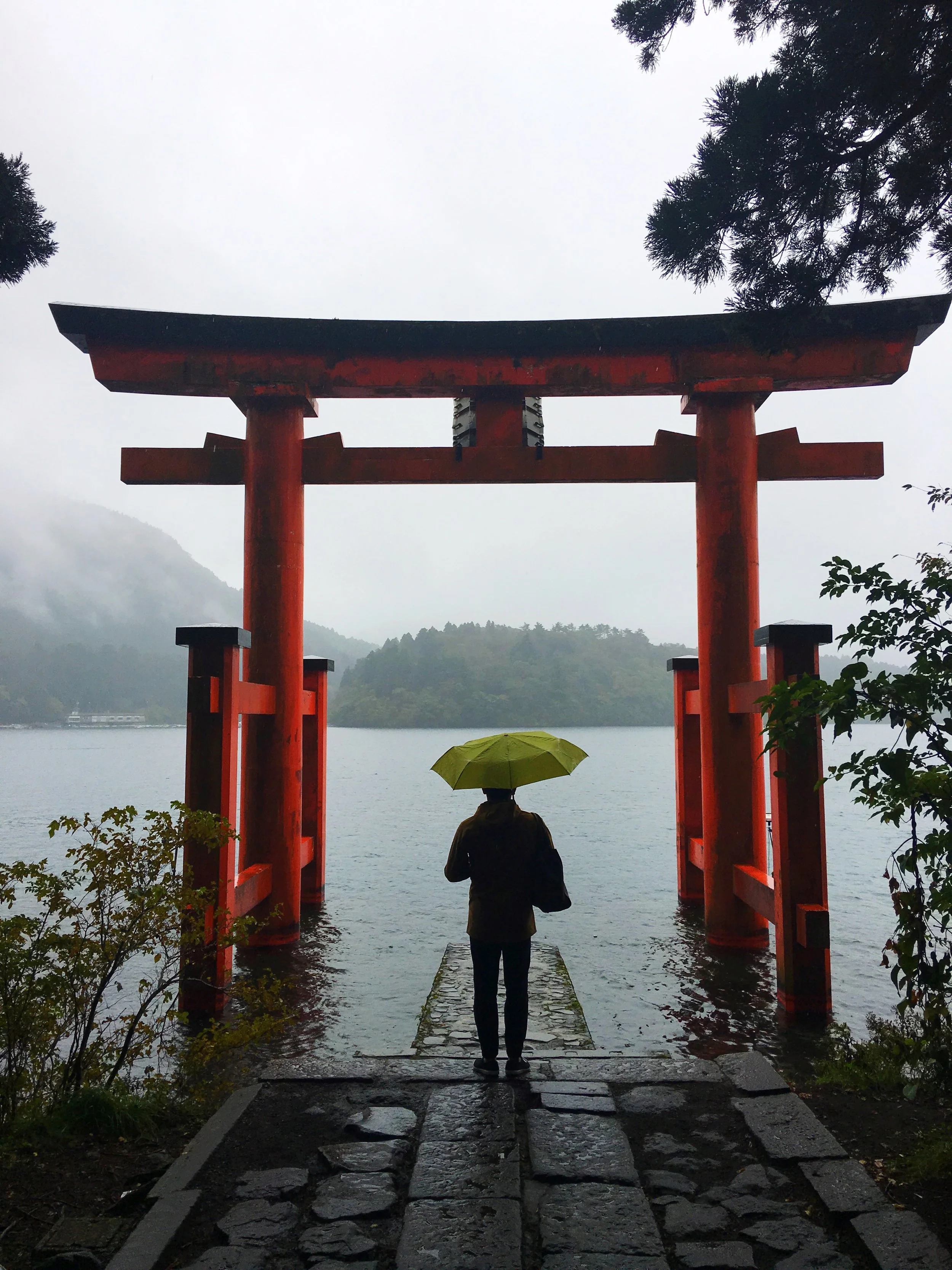 The path further past the torii gate seen above eventually leads, with flanked lantern paths, to the Hakone Shrine where the shrouding of fog gives off a serene atmospheric gift.