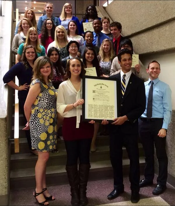 university of wisconsin - milwaukee members holding their original charter