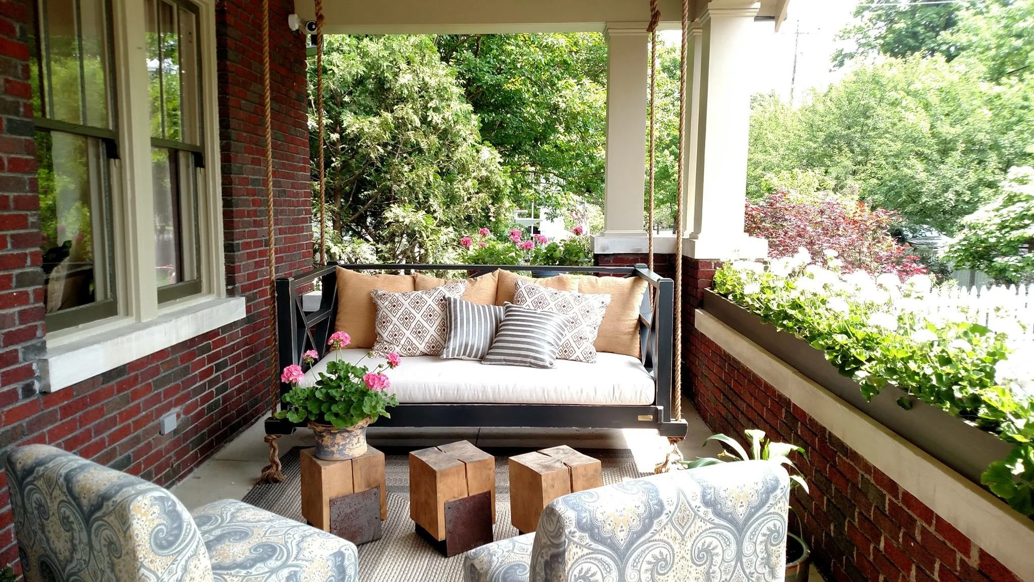 We designed the front porch of the O'More Show House as an extended living space where a family could hang out and entertain.