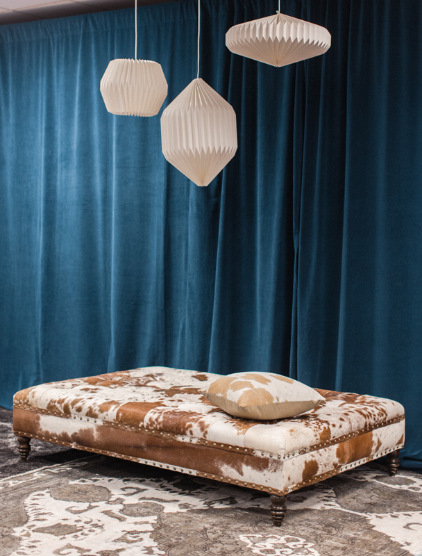 This oversized cowhide ottoman adds playfulness to the CMA Fest Green Room  | City Farmhouse Interior Design