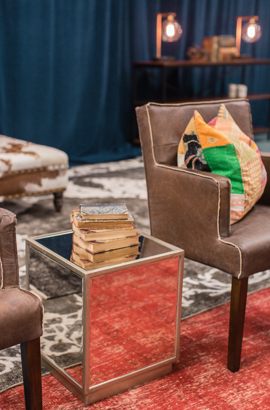 Mirrored square side tables reflect the beautiful Persian rugs throughout the CMA Fest Green Room | City Farmhouse Interior Design