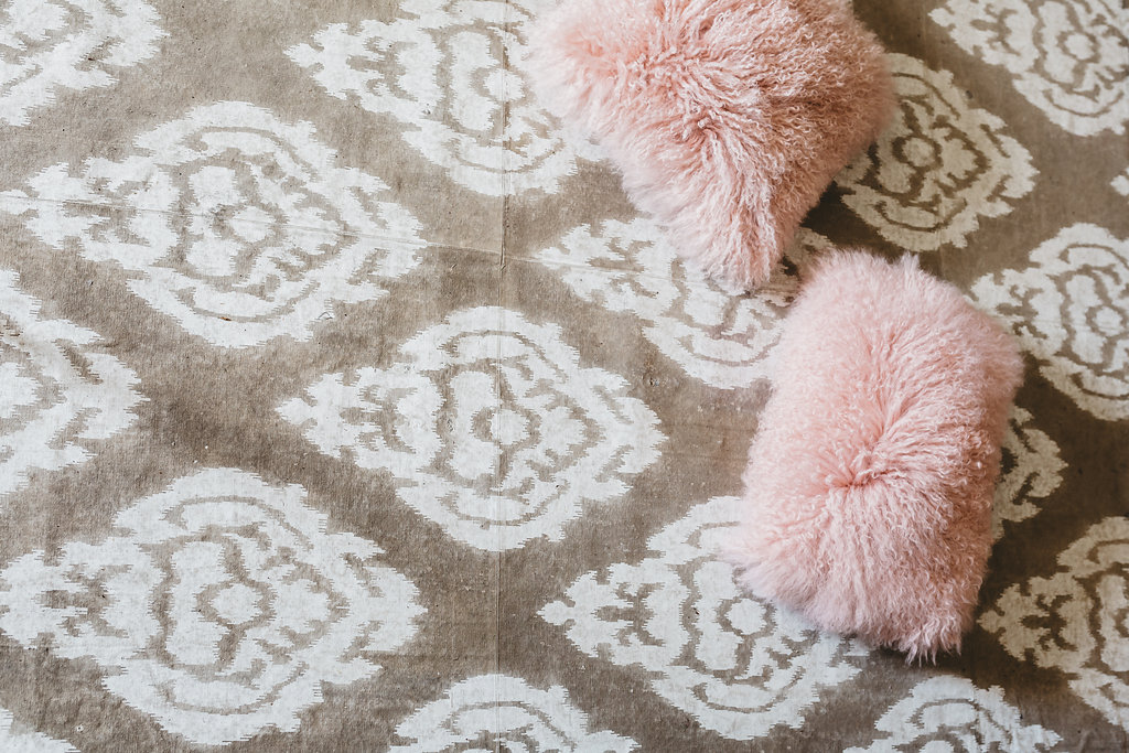 A diamond pattern rug sits on the floor of the McConnell House bridal suite | Interior designer: Kim Leggett