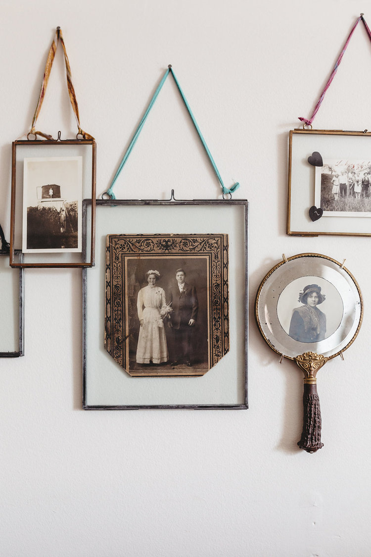 Vintage pictures hang on the walls in the bridal suite at the McConnell House | Interior design: Kim Leggett, owner of City Farmhouse