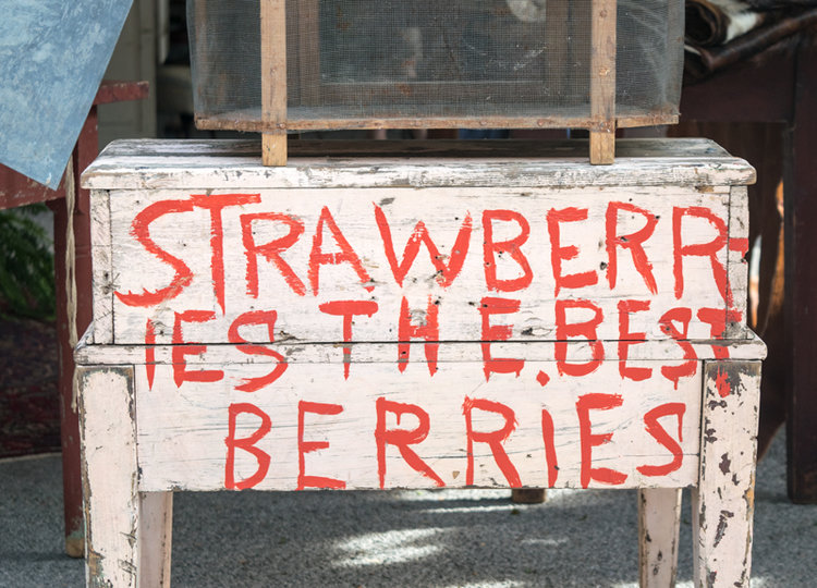 An adorable vintage produce desk reading "Strawberries the best berries" at the City Farmhouse Pop Up Fair | June 2017 | Franklin, TN