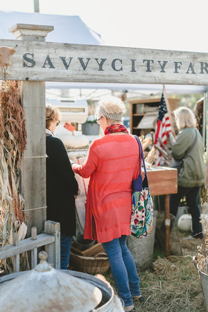 Crowd shopping the Savvy City Farmer booth