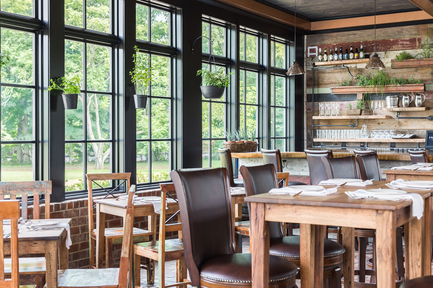 Huge window flank one side of the bar at Homestead Manor | Interior Design: Kim Leggett | Photographer: Alyssa Rosenheck