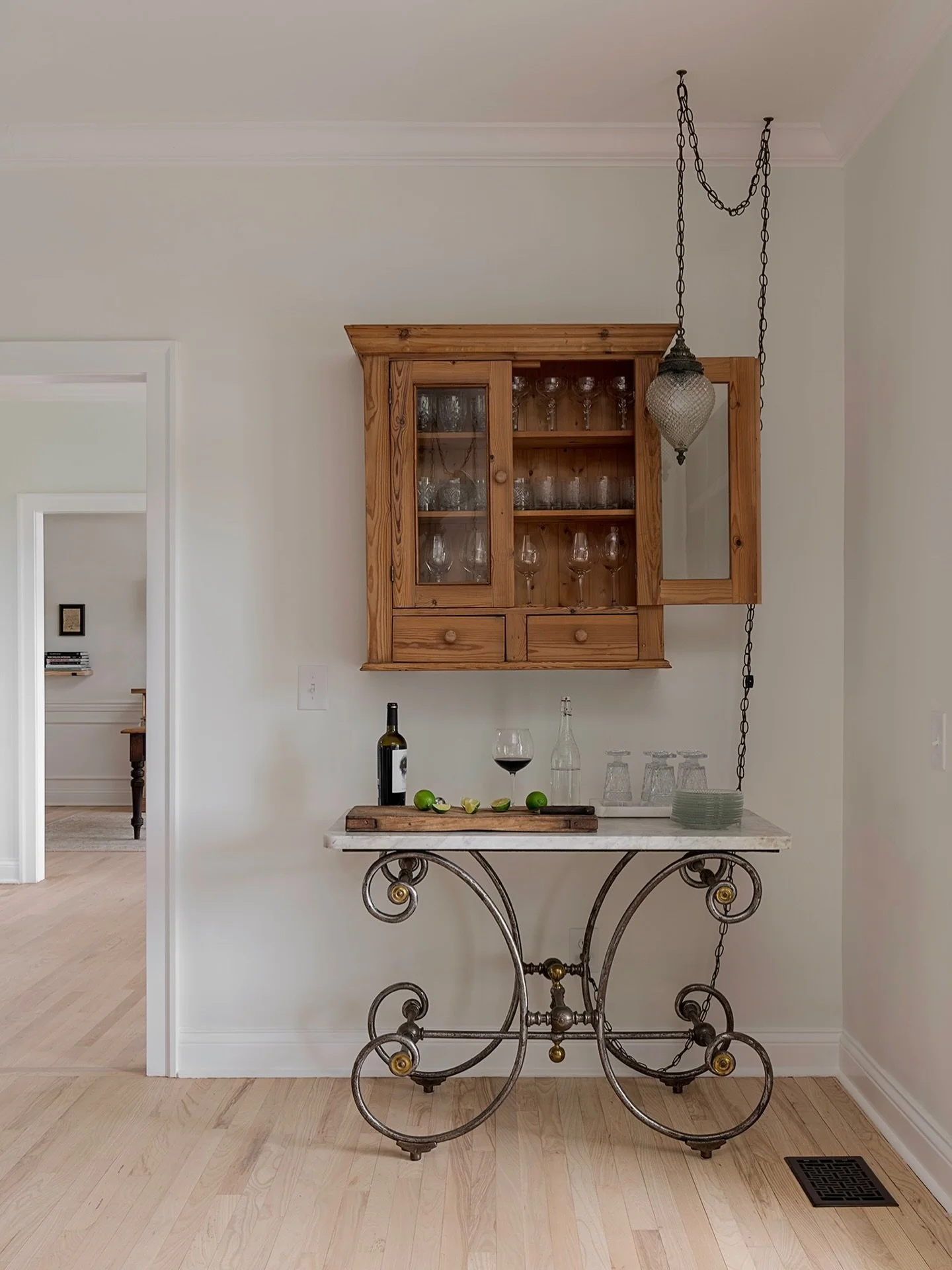 Another one of my favorite tucked in corners of the dining room @idlewildfarmtennessee. So much fun to design this special home. Found the antique French pastry table for use as a mixing table @thenashvilleshow &amp; the hanging cupboard used for sto