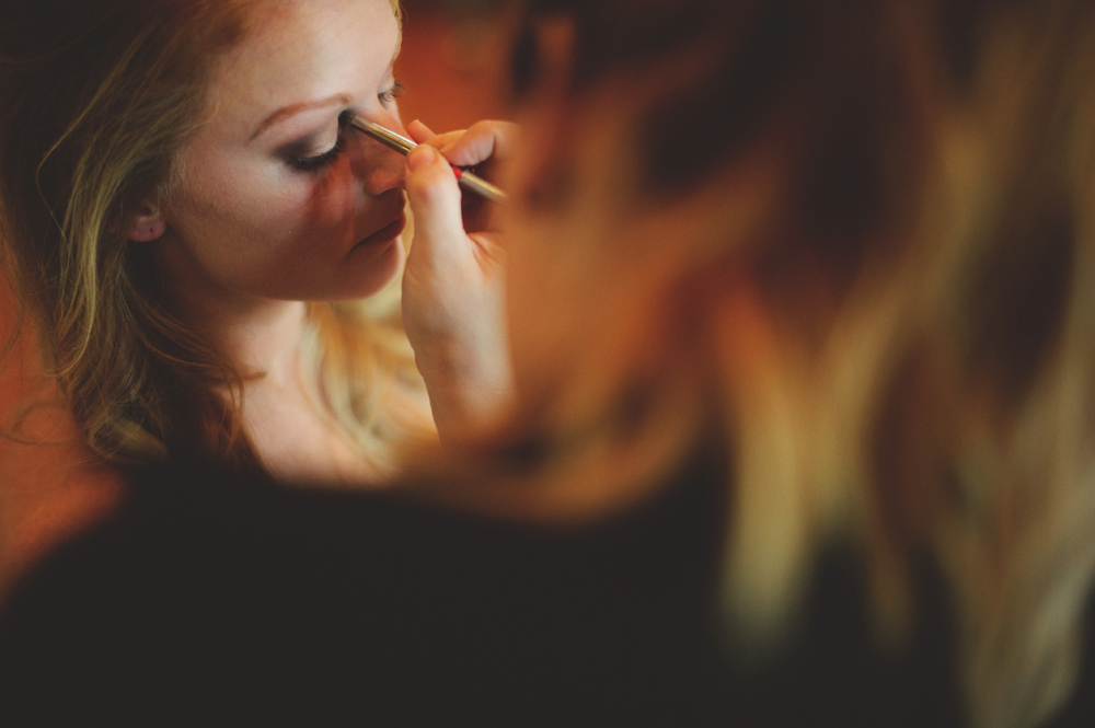 mint springs farm wedding: bride getting makeup done