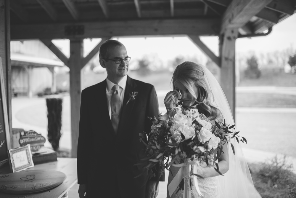 bride crying before waling down aisle