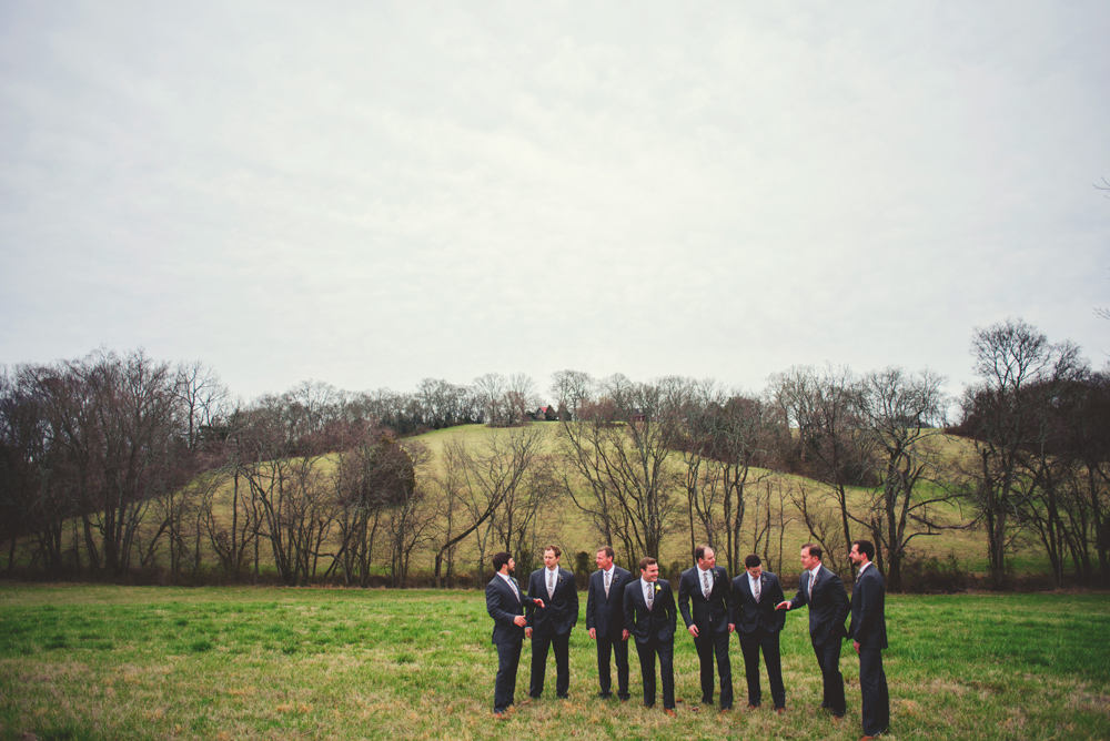 mint springs farm wedding: groomsmen laughing