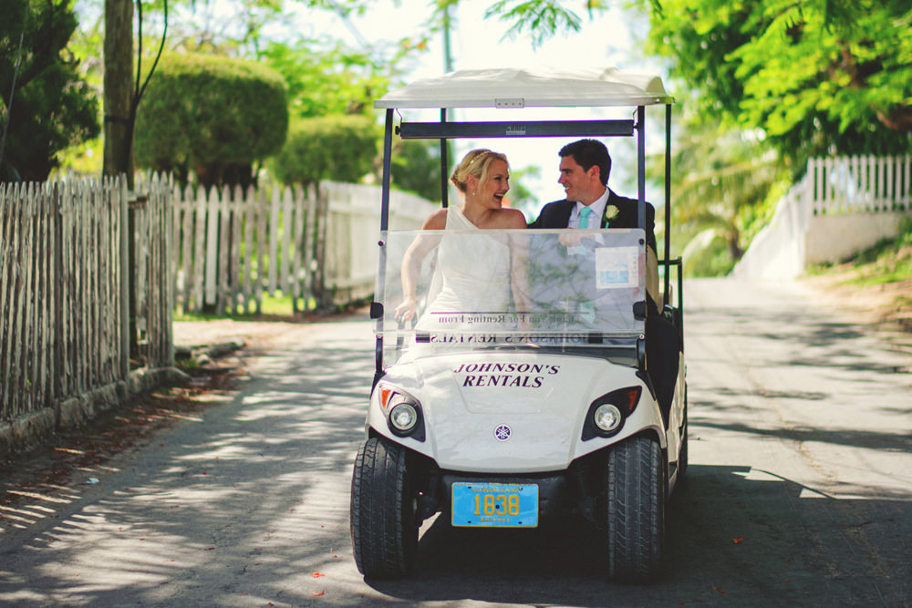 ocean view club wedding : bride and groom on a golf cart